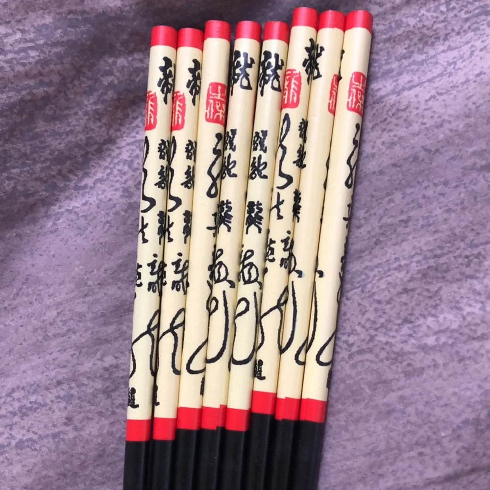 Set of 8 chopsticks, never used.